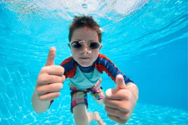 Kids enjoying a safe swimming lesson at a family pool in Mill Valley, California