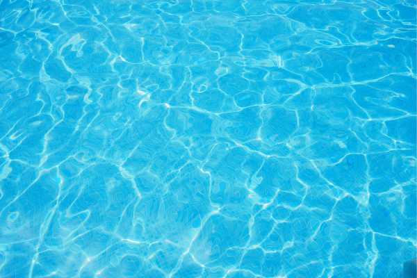 Comparison of old worn plaster and new smooth blue pool surface in Los Altos Hills, California